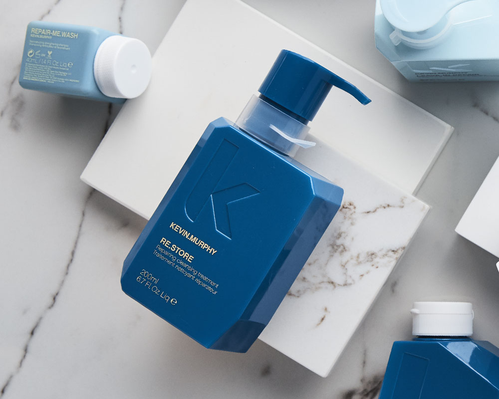 Blue bottle of Kevin Murphy's RESTORE repairing, cleansing and conditioning treatment for all hair types